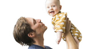 man lifting and smiling with baby